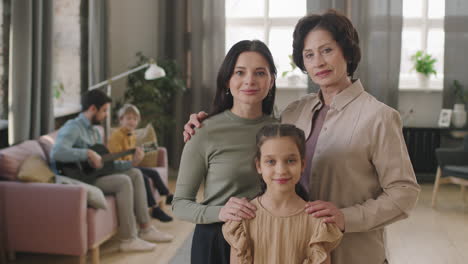 a multigenerational family portrait featuring a grandmother, mother, and daughter
