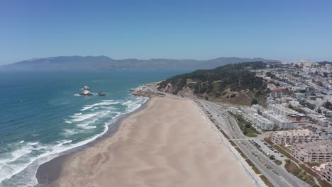 Aerial-shot-flying-over-Ocean-Beach-towards-Land's-End-in-San-Francisco