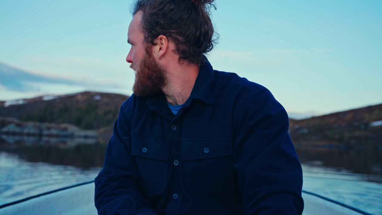 Male Paddling His Boat In Reinsjoen, Norway - Close Up