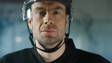 Close-Up-Of-A-Happy-Male-Hockey-Player-Looking-Cheerfully-At-The-Camera-On-The-Ice-Arena