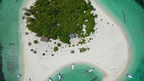 top down bird's eye view perspective of patawan island, balabac with banca canoe