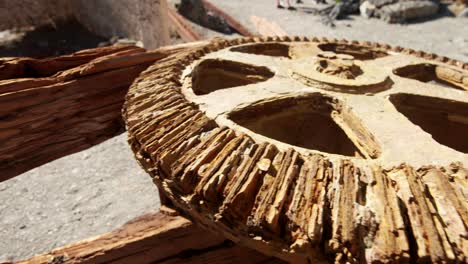 rusty old mechanic cog wheel in sulfur production factory, whakaari white island