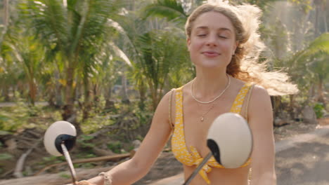 beautiful-woman-riding-scooter-on-tropical-island-road-trip-enjoying-motorcycle-ride-exploring-freedom-on-vacation