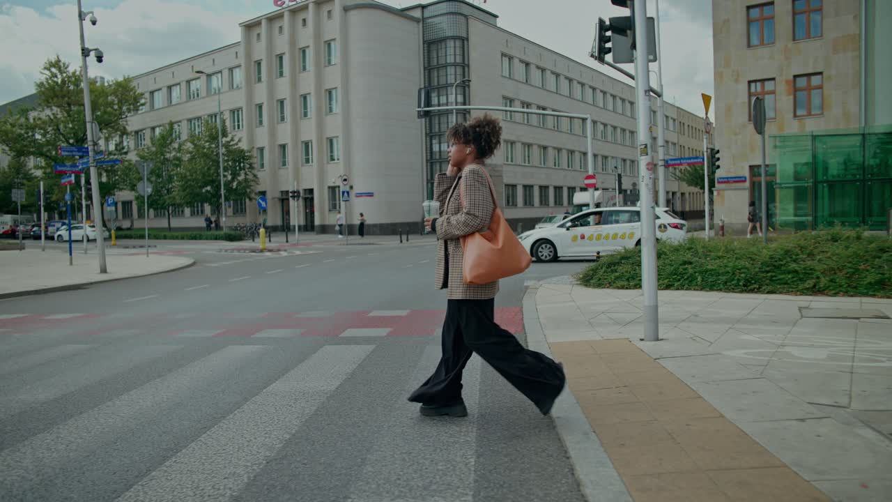 Woman crossing a street in the city