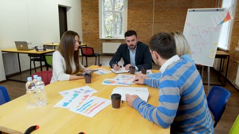 business team meeting involved diverse people participating in creative sustainable ideas steadicam shot across boardroom table shared work space