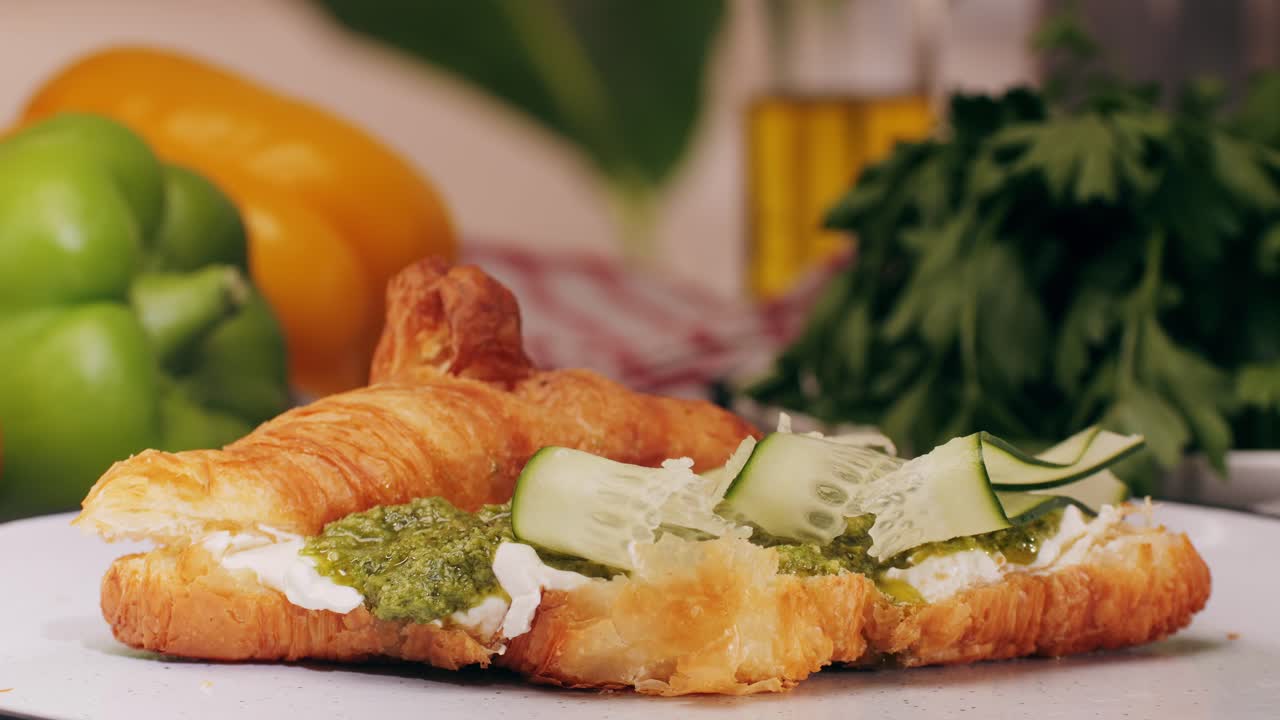 Croissant with jamon ham, Salmon, in Modern Cafe, Top View of Healthy Breakfast in Cafe. English breakfast: fried egg, bacon toast on sandwich.