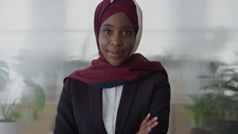 portrait-successful-black-business-woman-smiling-arms-crossed-enjoying-professional-management-career-beautiful-african-american-muslim-female-wearing-hijab-in-office