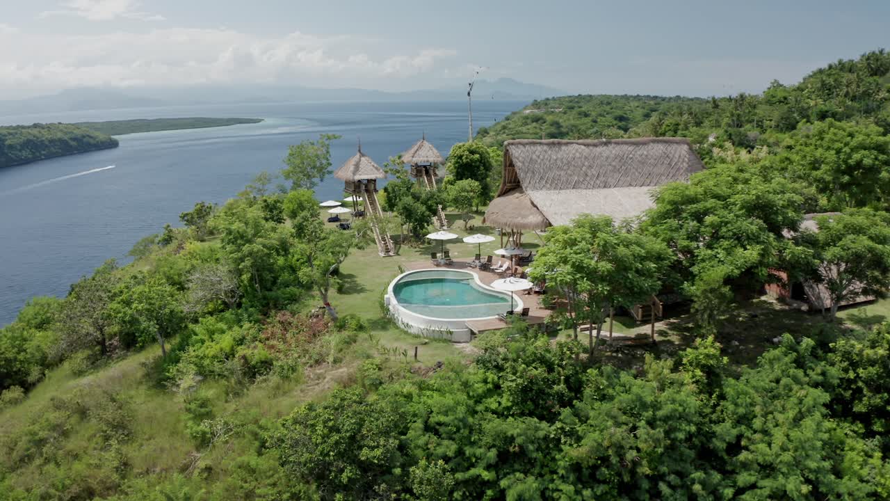 Stunning aerial drone view of Amok Sunset, a popular sunset point perched high on a cliff in Nusa Penida, Bali, Indonesia