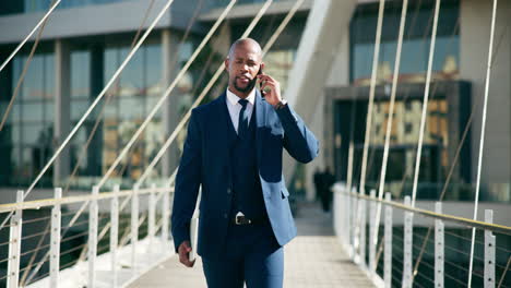 businessman walking and talking on the phone