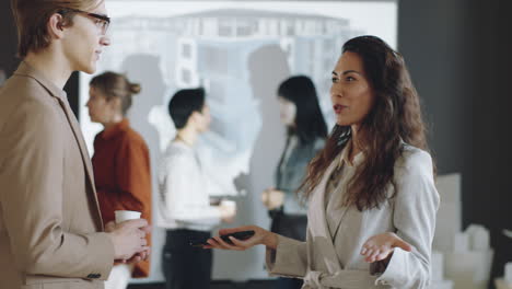 Man-and-Woman-Speaking-on-Business-Event