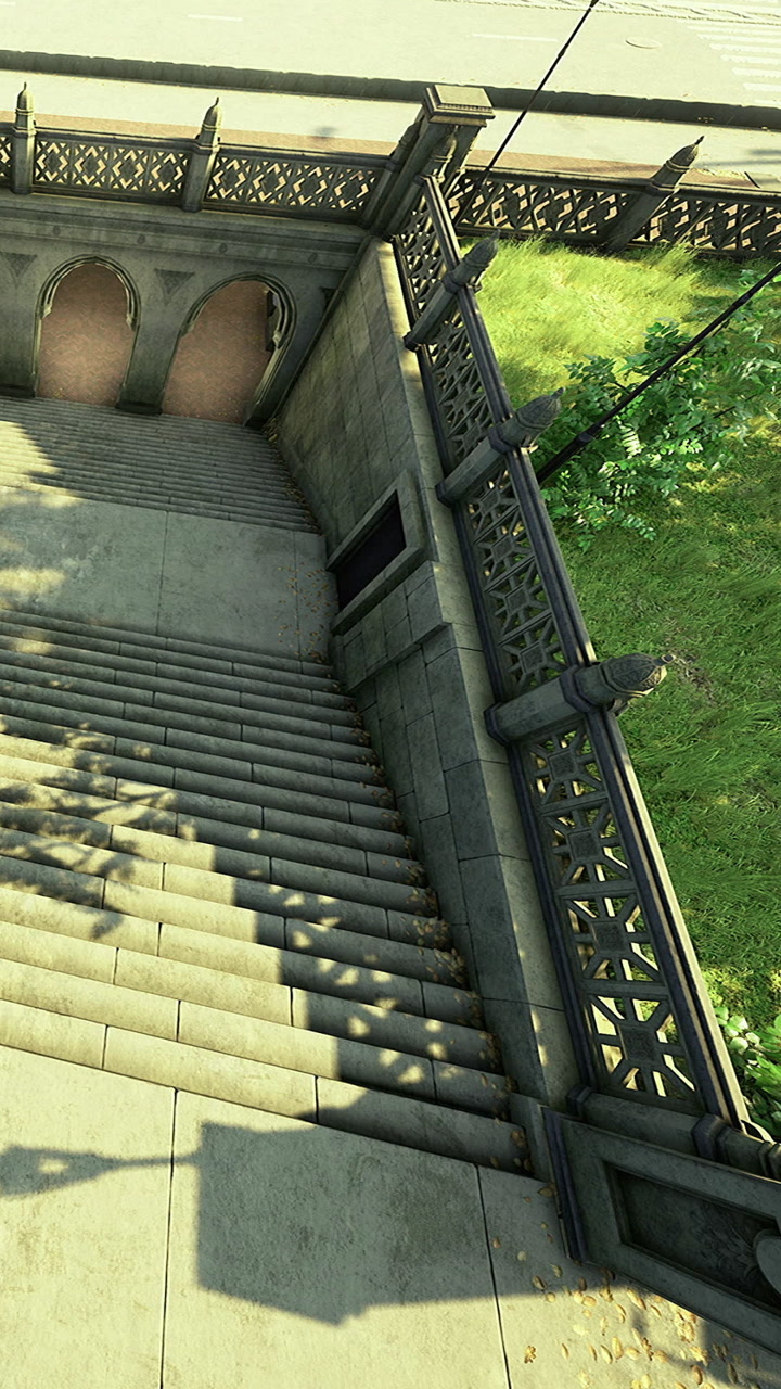 Steps lead to a tranquil park area with beautiful shadows under the sun