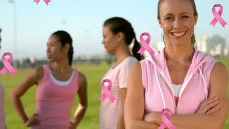 animation of pink breast cancer ribbons over group of smiling women