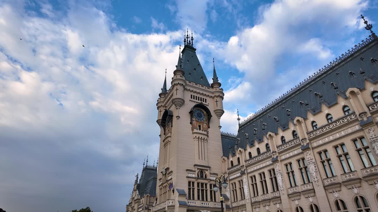 Urban landscape featuring the Palace of Culture in Iași with dynamic cloud movement