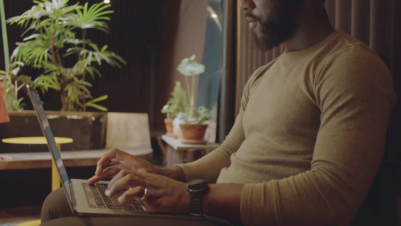 Man working on laptop in office