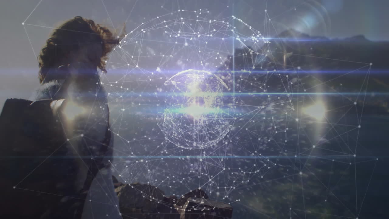 woman gazing coastal overlook, showcasing floating holographic network sphere for tech design