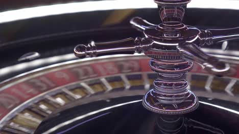 Close-up-shot-of-a-shiny-silver-European-roulette-wheel-with-red-and-black-colors-where-you-bet-just-before-the-ball-lands-on-a-lucky-number