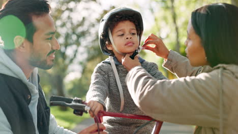 helmet, bicycle and parents with child in park