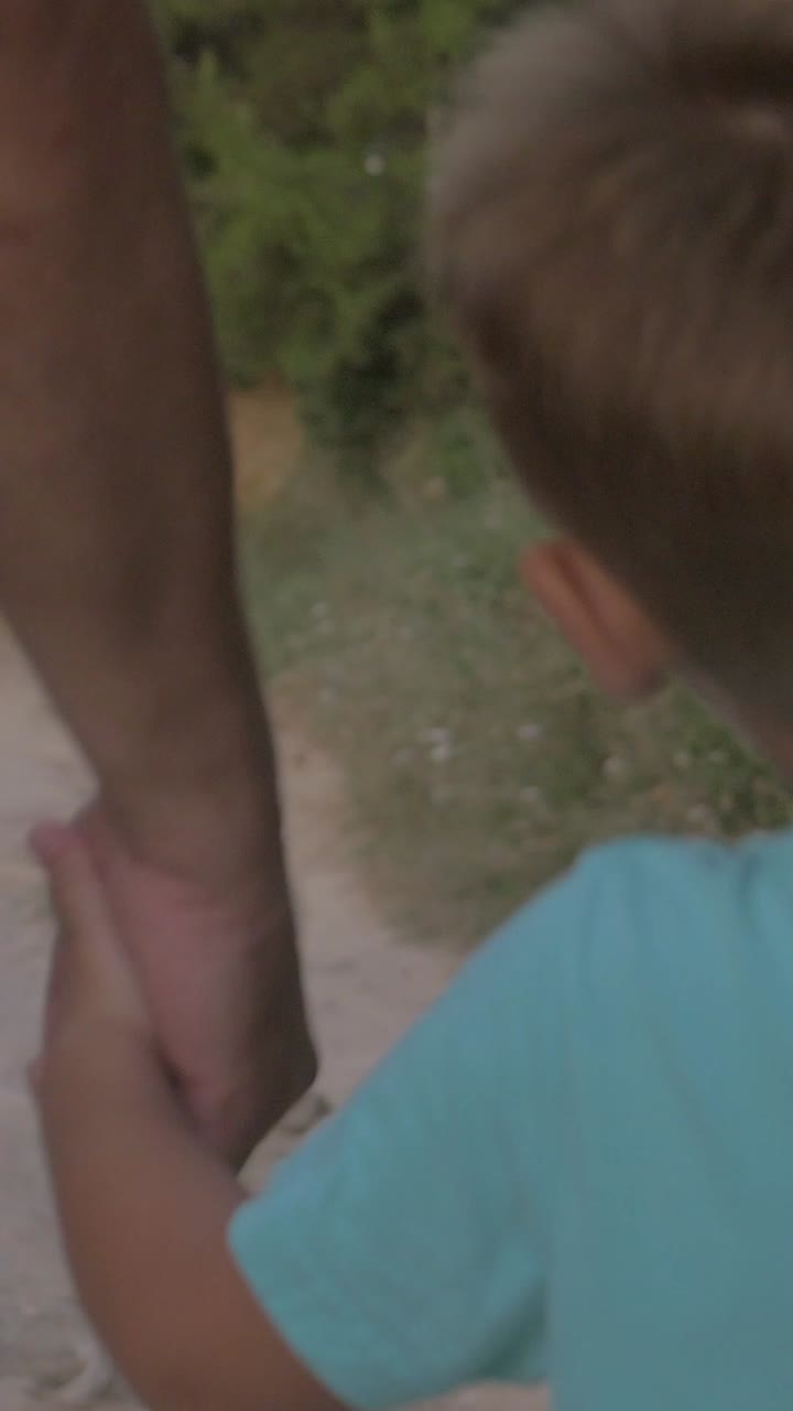 Father and Son Walking on a Path