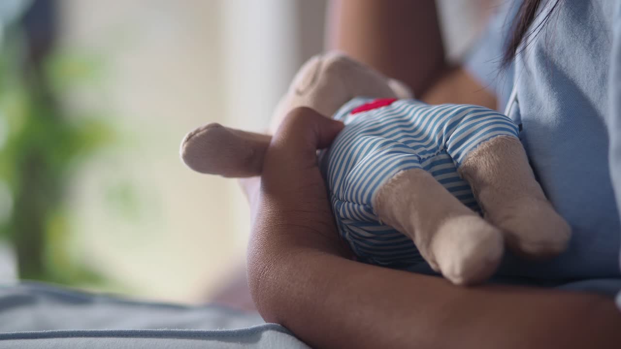 Child holding a stuffed animal