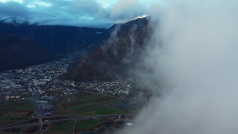 aerial view of clouds moving over the valley of martigny in switzerland