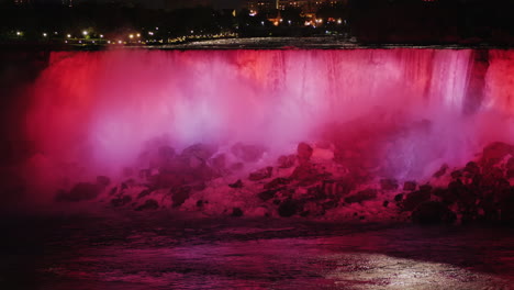 floodlit niagara falls at night