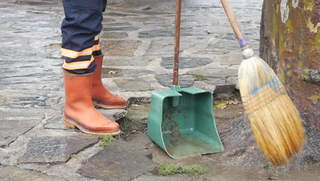 street sweeper cleans the sidewalk