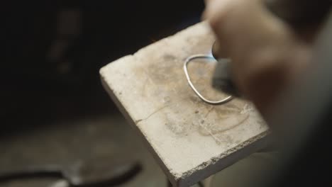 Jewelry-making,-shown-in-action.-Tempering-by-fire