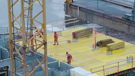 Three-construction-workers-finishing-their-working-day