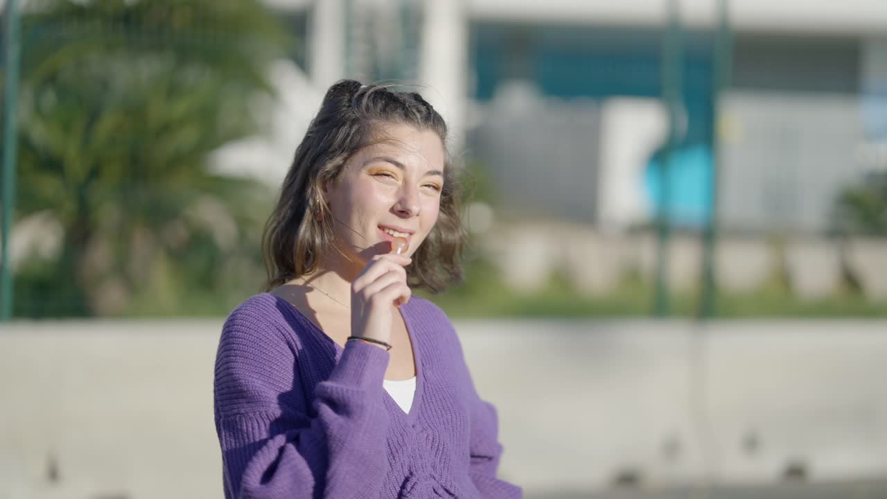 Young woman in a purple sweater