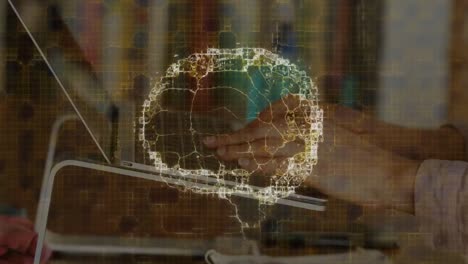 animation of human brain spinning over woman using laptop