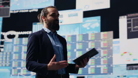 motivational speaker and businessman presents speech to engaged crowd