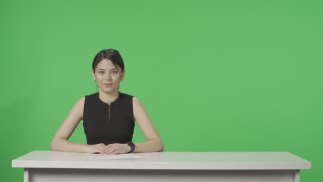 woman reporter at a desk