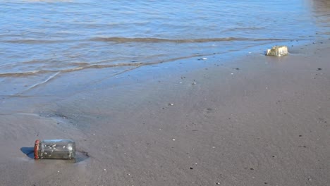 a still shot of plastic pollution on a beach