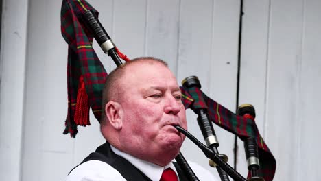 bagpiper playing at edinburgh fringe festival, august 2024