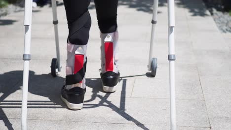 person using a walker with leg brace