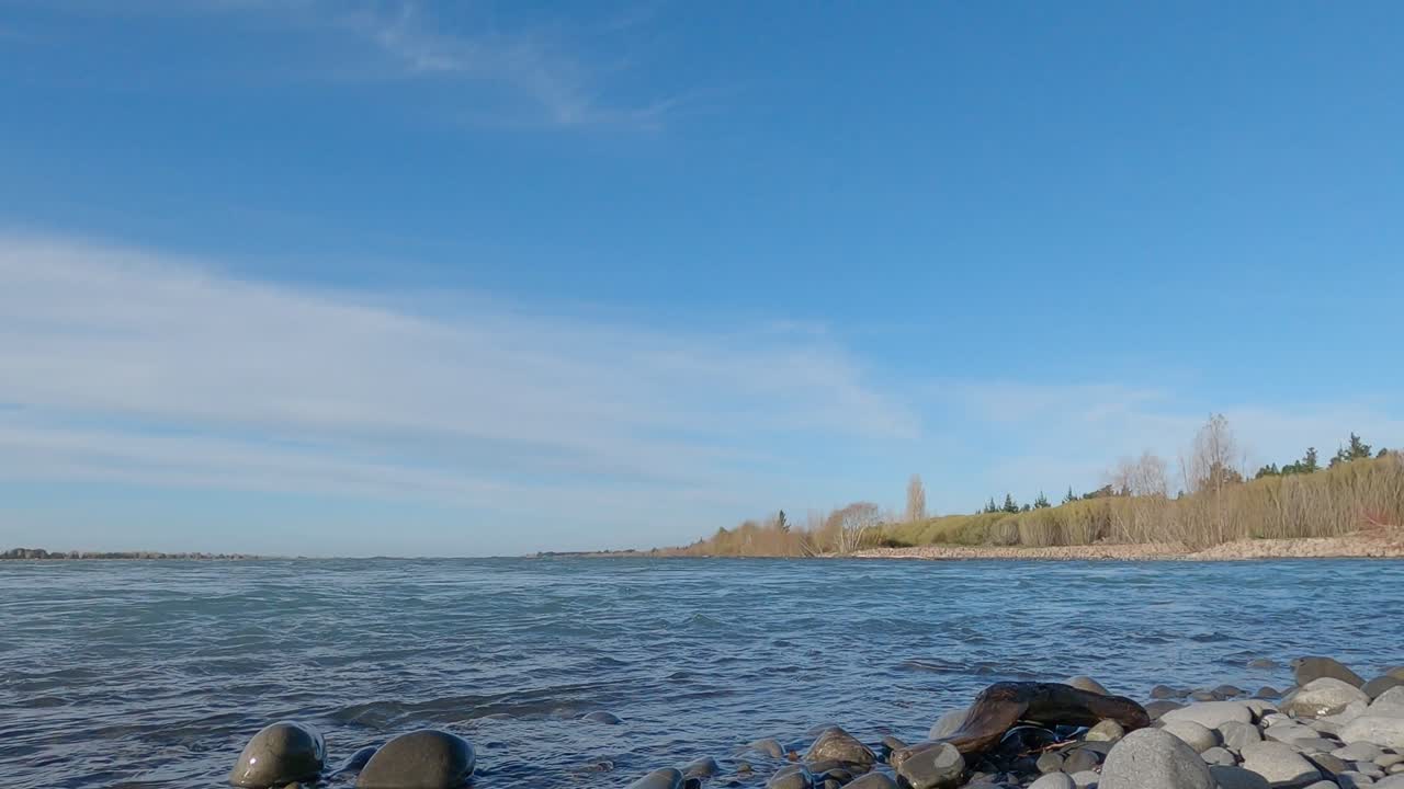 Fast flowing river late afternoon on winter's day - Waimakariri River, New Zealand