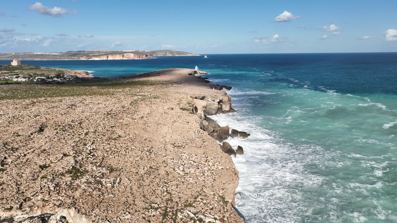 Drone Video Flying Backwards Along the Cliffs by Ghar Ic-Comb in Malta
