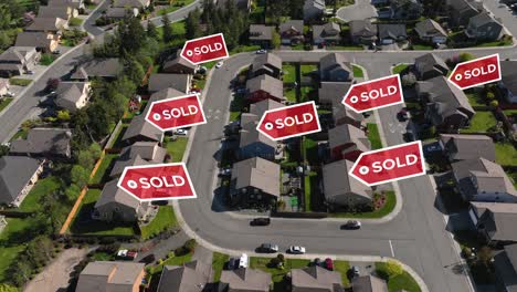 drone shot of sold signs popping up over recently sold houses in a suburban neighborhood