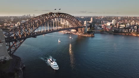 aerial static, rush hour traffic crossing sydney harbour bridge, australia