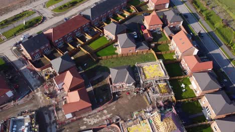drone aerial view of house building site in cheshire, england, uk, europe, illustrating urban development due to housing shortage in the uk.