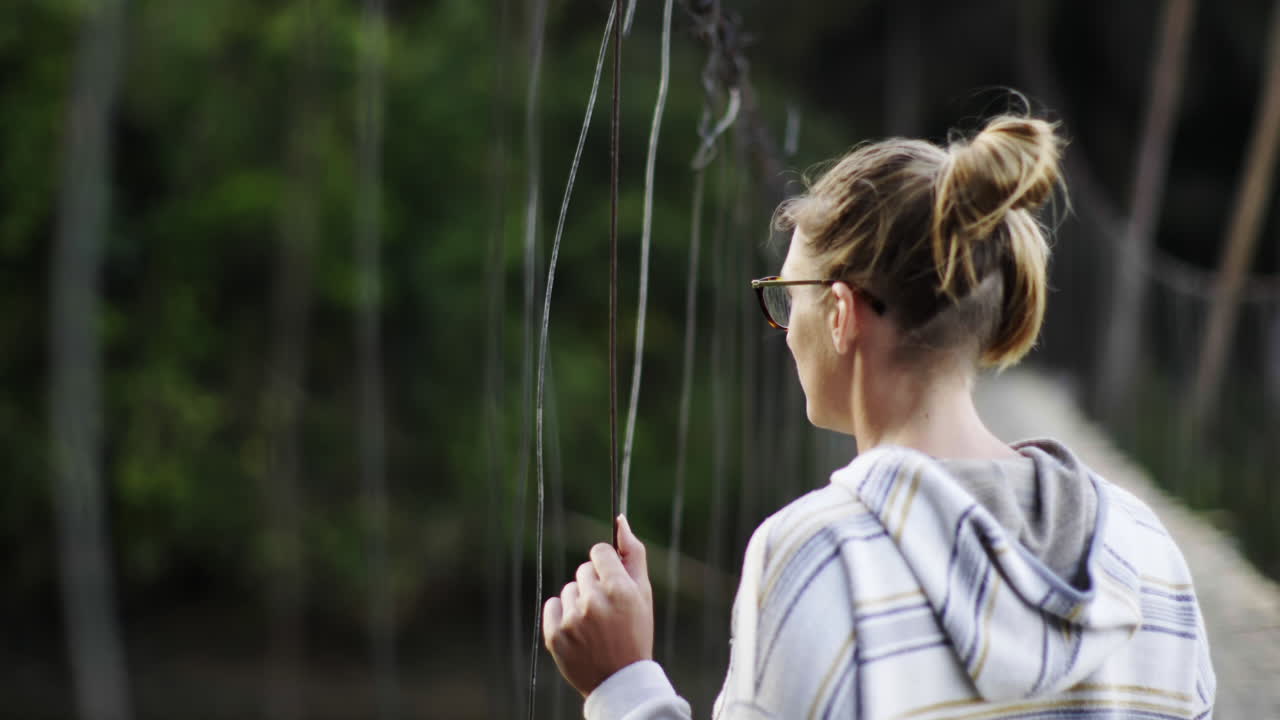 Woman on a Suspension Bridge