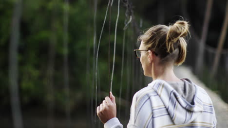 woman on a suspension bridge