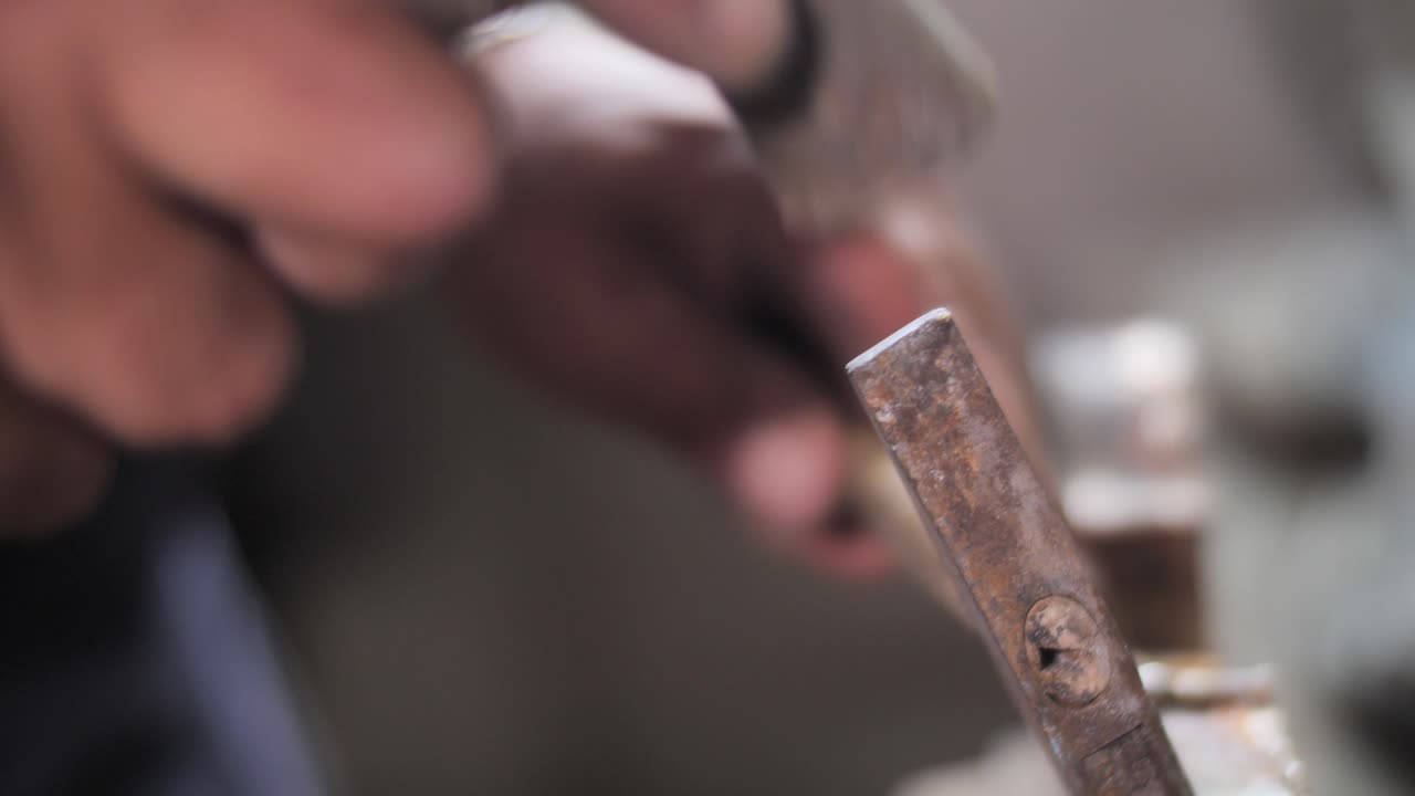Arts and crafts, hands use small hammer, precise work, luthier artisan workshop