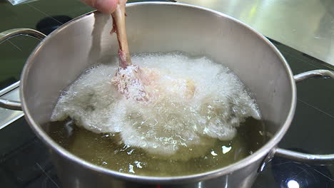 frying chicken in a pot