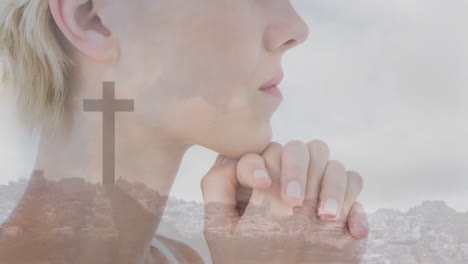 praying woman holding cross with animated landscape background