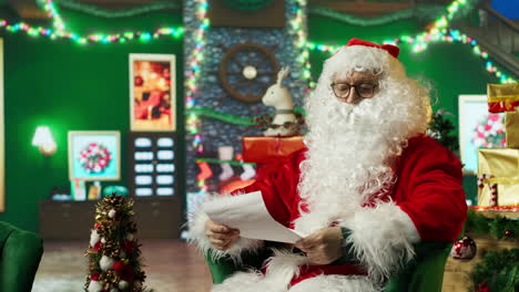 santa reading a letter on christmas eve