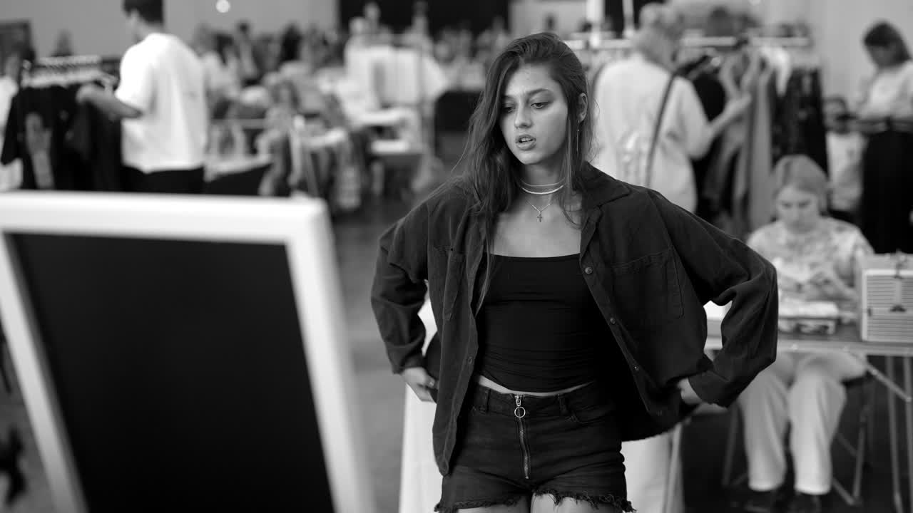 A woman trying on clothes at an event