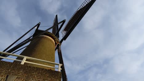 a traditional dutch windmill close up from the side