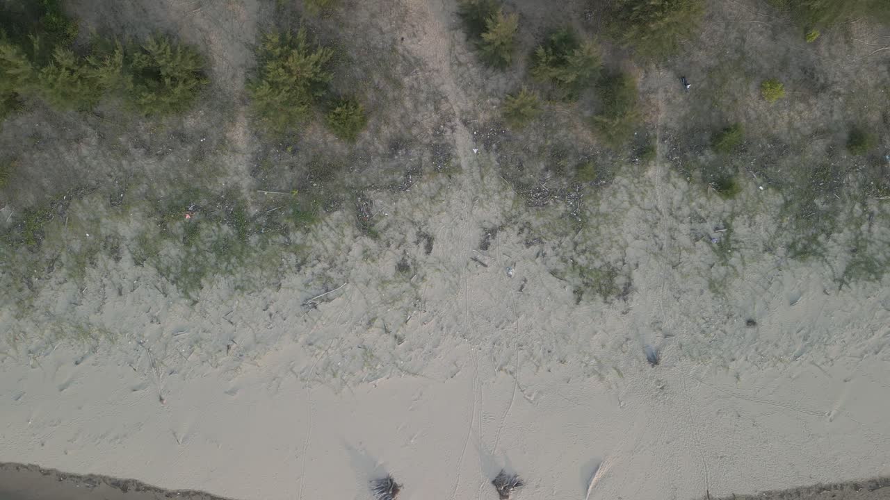 Aerial Drone View During Summer Gerigat Fishing Village,Kabong With, Facing Open Blue Sea, White Sandy Beach,Green Coconut, Palm Trees,And River,Sarawak,Borneo