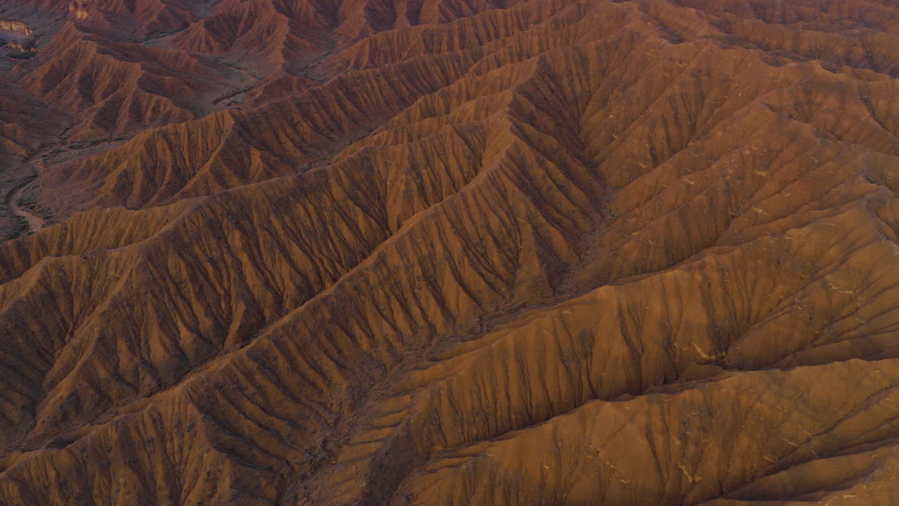 Unique Geological Formations Of Ak-Sai Canyon (Valley of Forgotten Rivers) During Sunrise In Kyrgyzstan, Central Asia. Aerial Shot